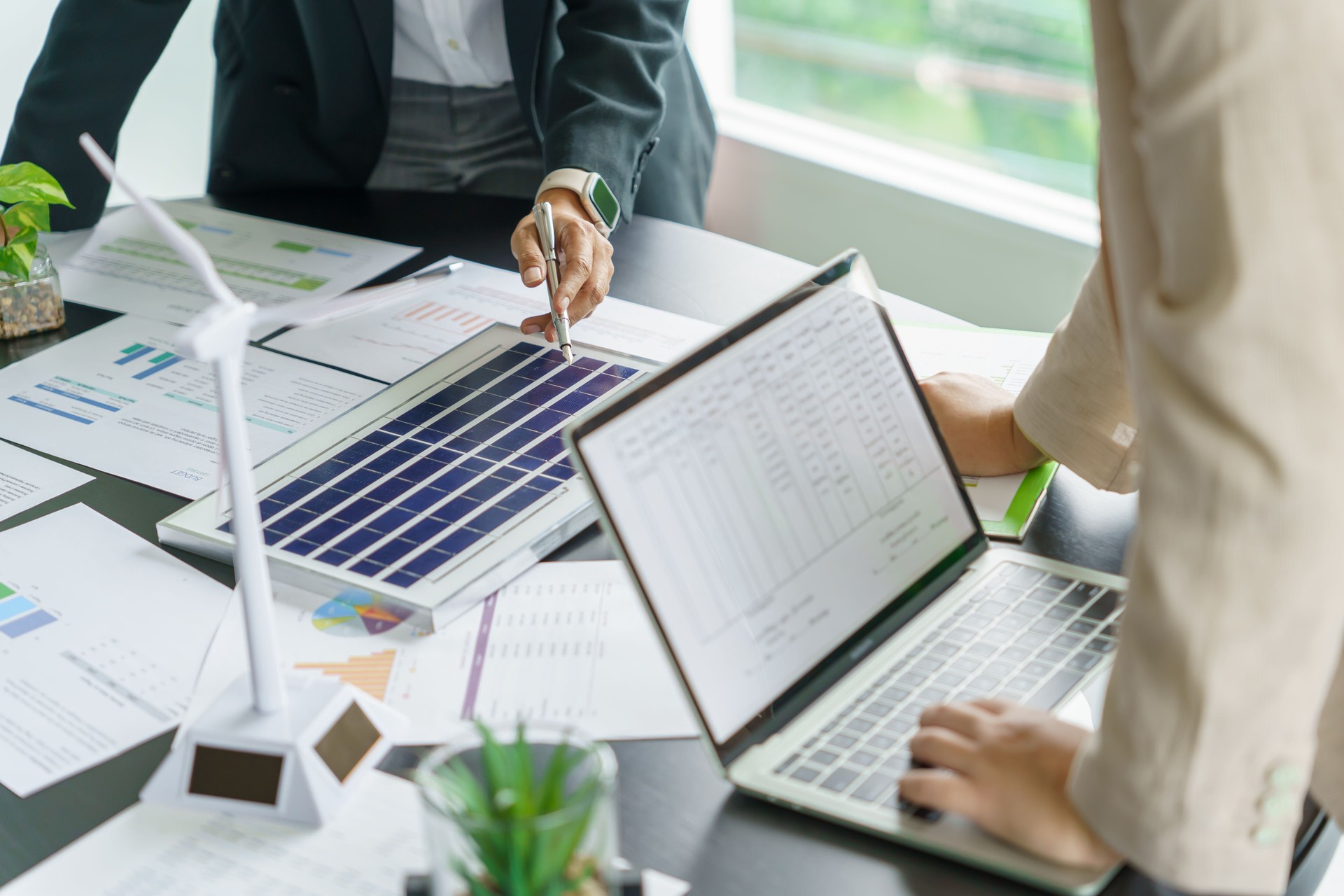 Solar panels green energy Business people working in green eco friendly office business meetingÂ creative ideas for business eco friendly professional teaching corporate people sustainable electricity project business